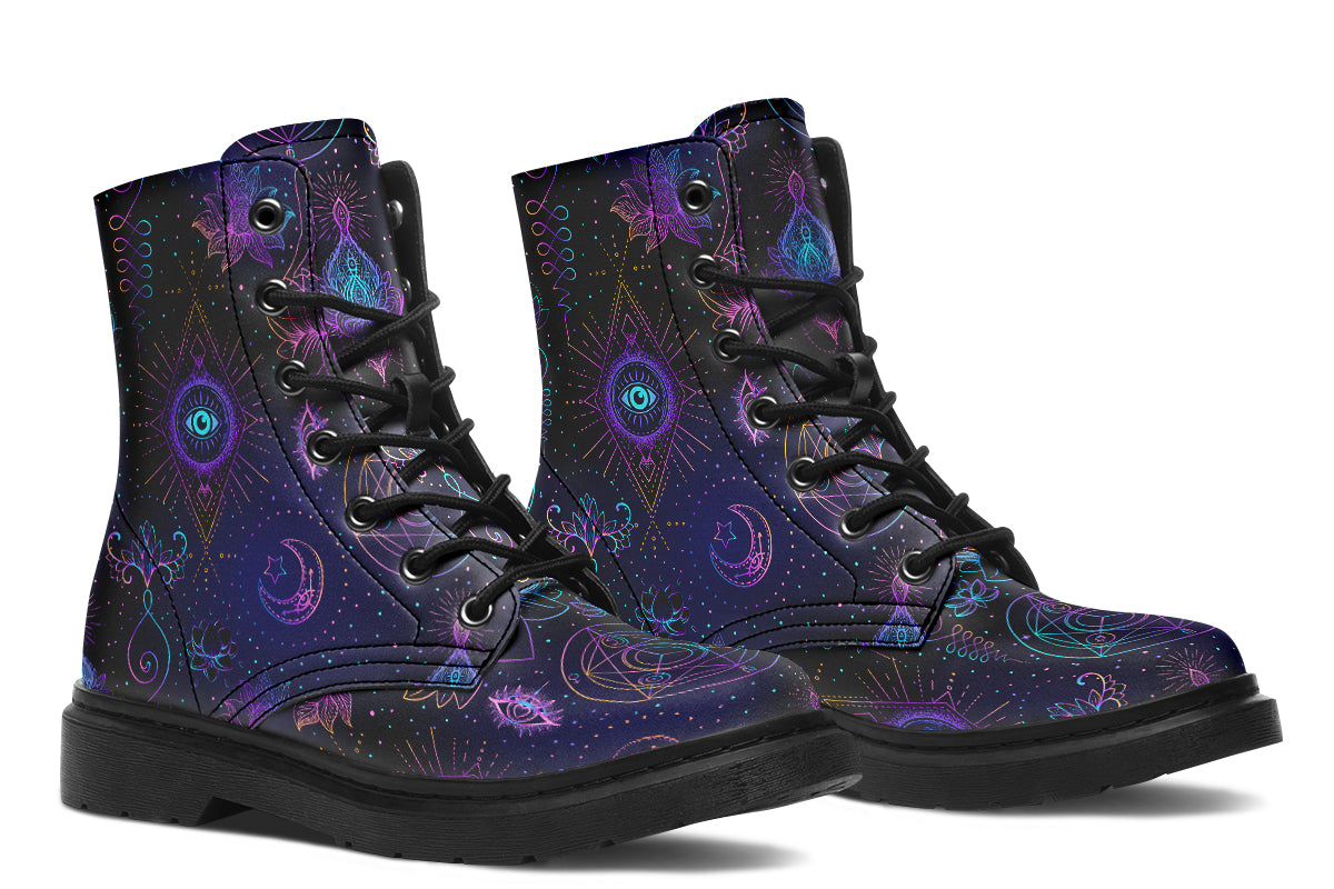 Boots featuring a dark violet, almost black background with a rainbow gradient pattern of different symbols such as a lotus flower, moon, star, decorative dots and swirls and a blue eye surrounded by a circle and line patterns.