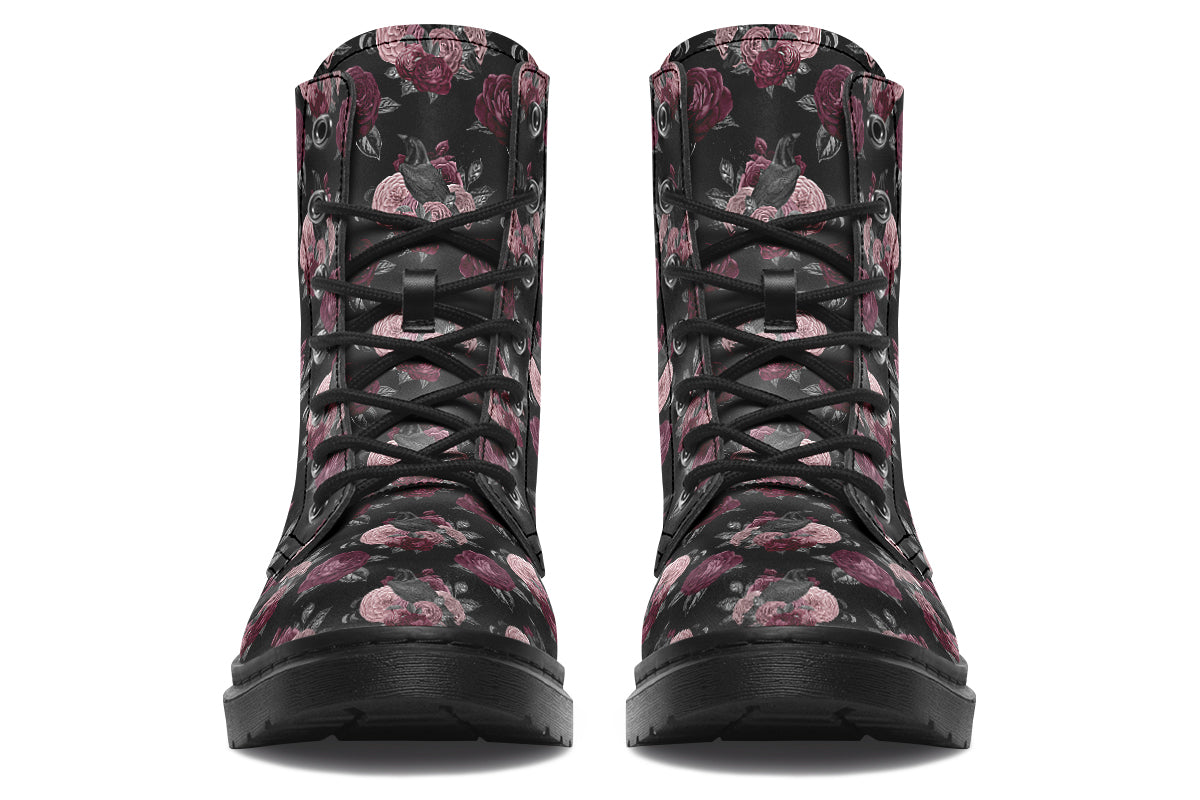 Black boots with a repetitive pattern of deep crimson and pink flowers with a black crow sitting in them