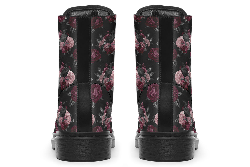 Black boots with a repetitive pattern of deep crimson and pink flowers with a black crow sitting in them