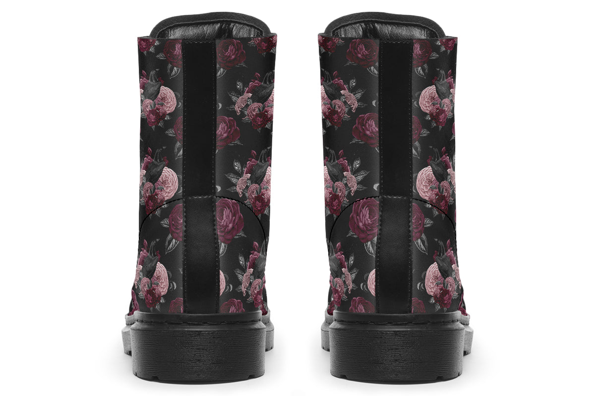 Black boots with a repetitive pattern of deep crimson and pink flowers with a black crow sitting in them