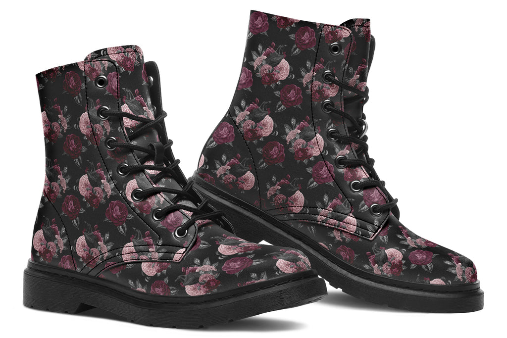 Black boots with a repetitive pattern of deep crimson and pink flowers with a black crow sitting in them
