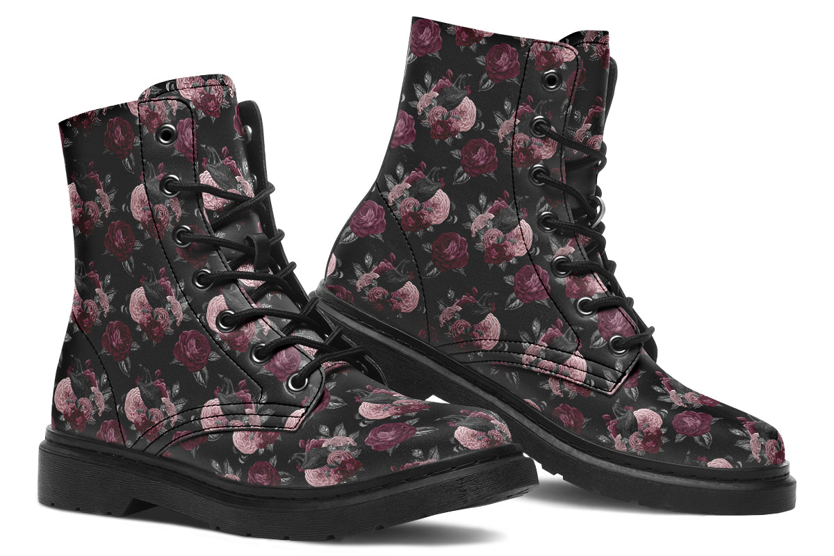 Black boots with a repetitive pattern of deep crimson and pink flowers with a black crow sitting in them