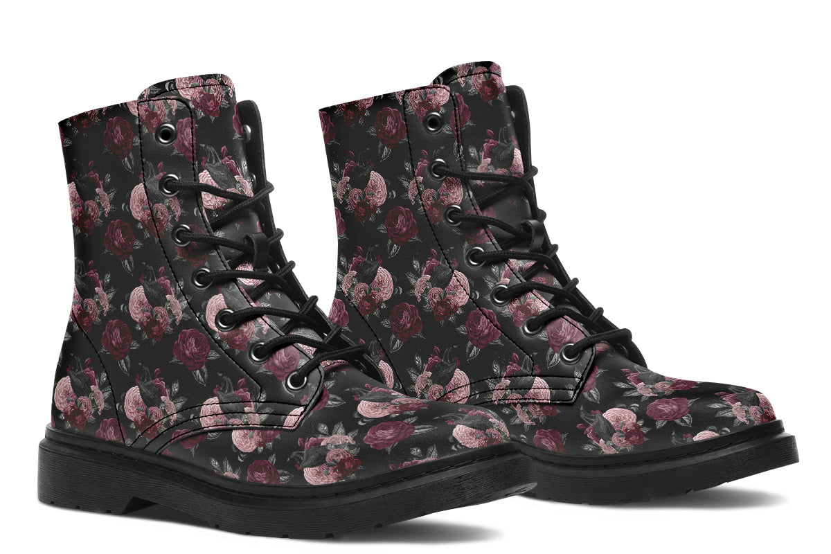 Black boots with a repetitive pattern of deep crimson and pink flowers with a black crow sitting in them