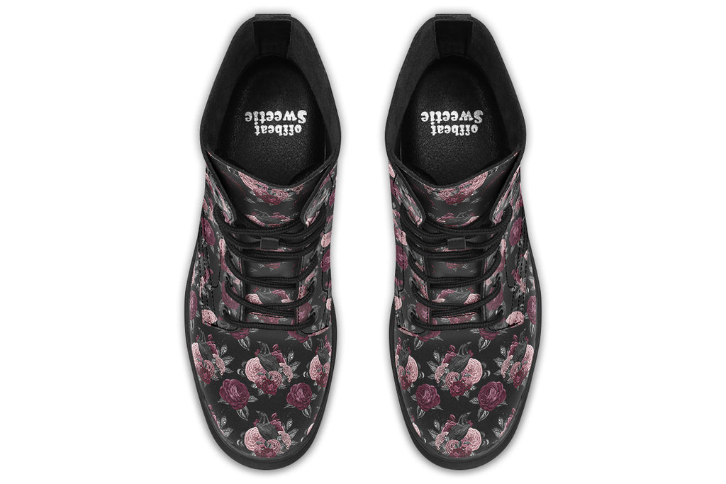 Black boots with a repetitive pattern of deep crimson and pink flowers with a black crow sitting in them