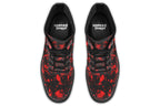 Black boots with red splatter pattern