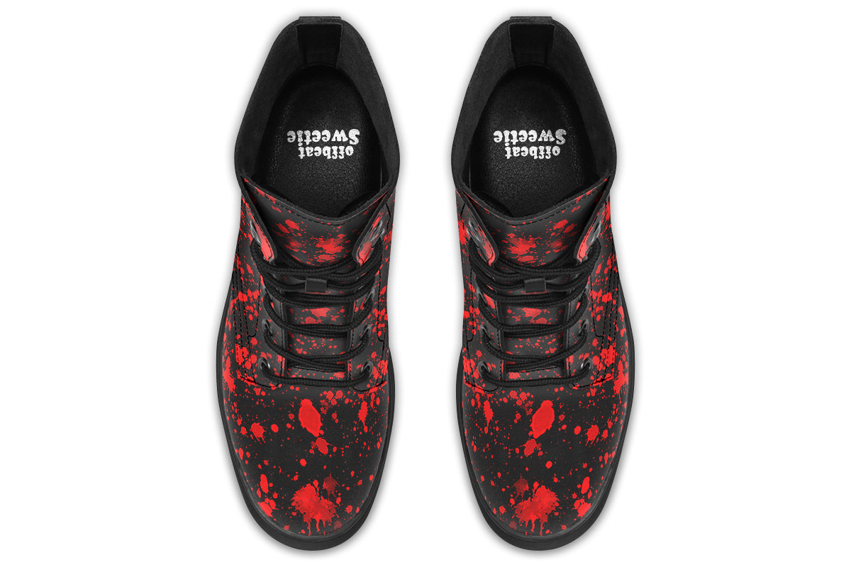 Black boots with red splatter pattern