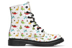 White boots featuring a pattern of different dinosaurs in Christmas hats and scarves. Some are holding gifts.