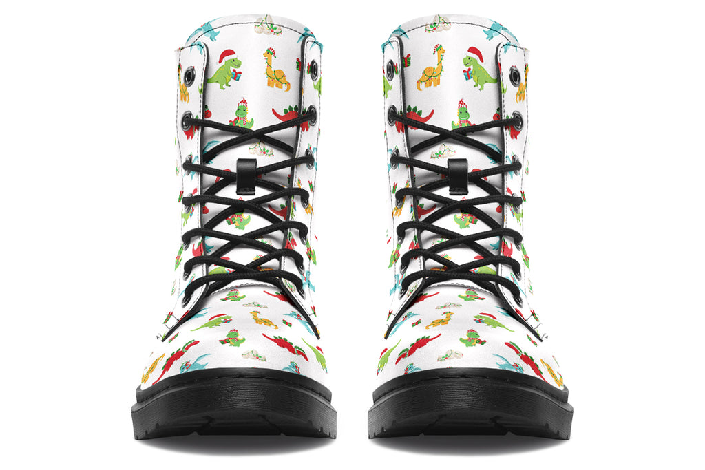 White boots featuring a pattern of different dinosaurs in Christmas hats and scarves. Some are holding gifts.