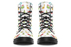 White boots featuring a pattern of different dinosaurs in Christmas hats and scarves. Some are holding gifts.