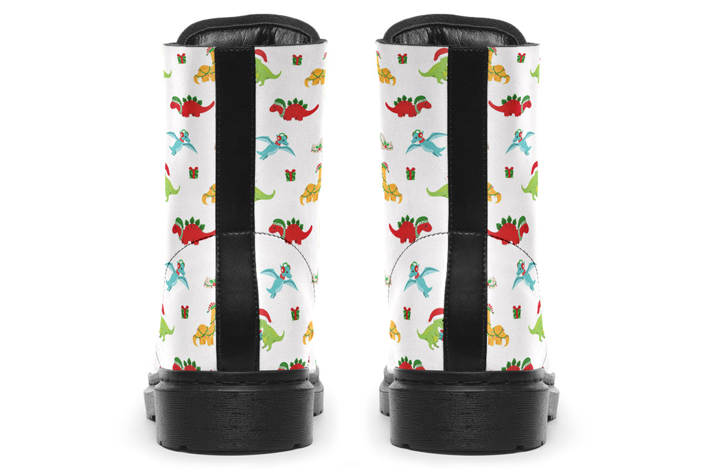 White boots featuring a pattern of different dinosaurs in Christmas hats and scarves. Some are holding gifts.