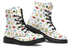 White boots featuring a pattern of different dinosaurs in Christmas hats and scarves. Some are holding gifts.