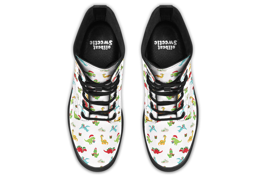 White boots featuring a pattern of different dinosaurs in Christmas hats and scarves. Some are holding gifts.