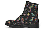 Black boots featuring a pattern of different dinosaurs wrapped in Christmas lights. Some are also wearing Christmas hats.
