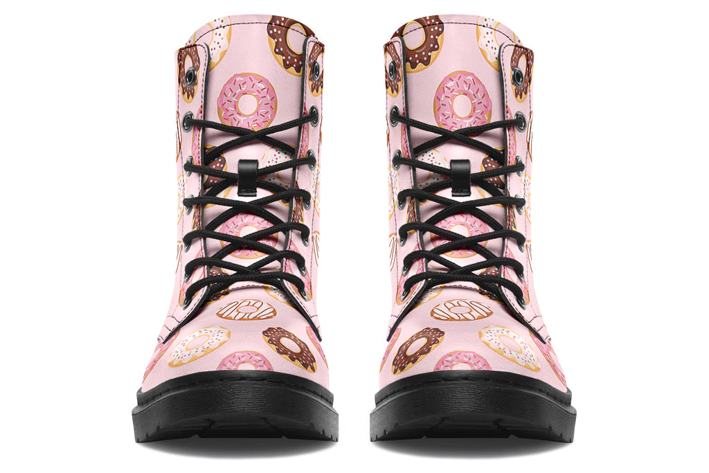 Pink boots with a pattern of donuts all over them