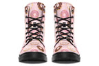 Pink boots with a pattern of donuts all over them