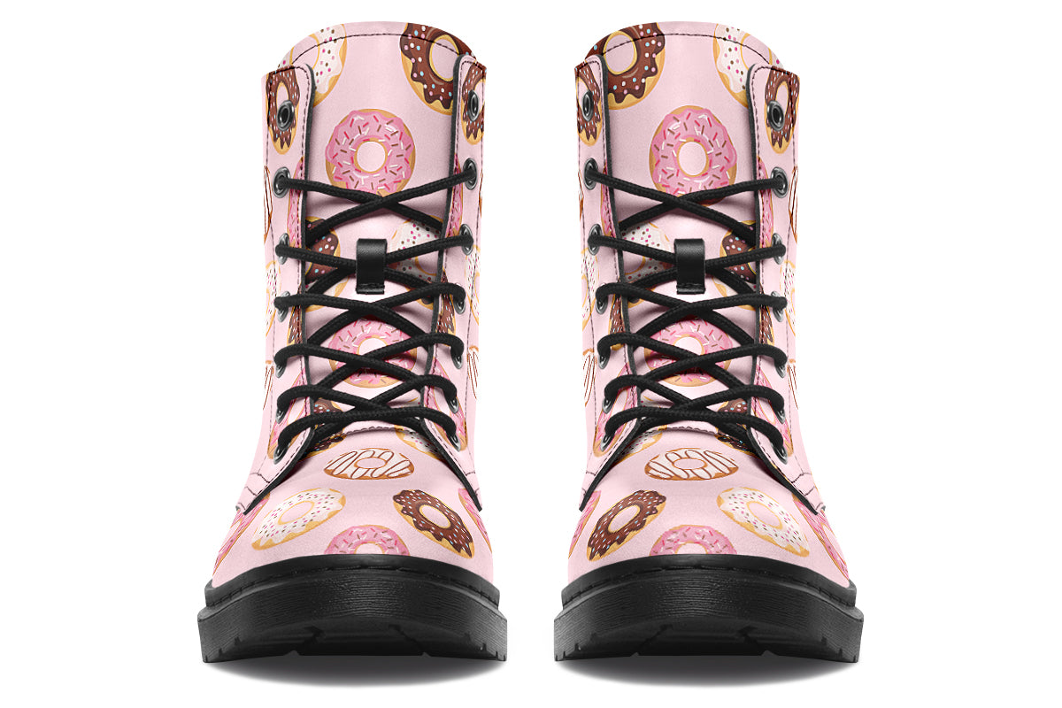 Pink boots with a pattern of donuts all over them