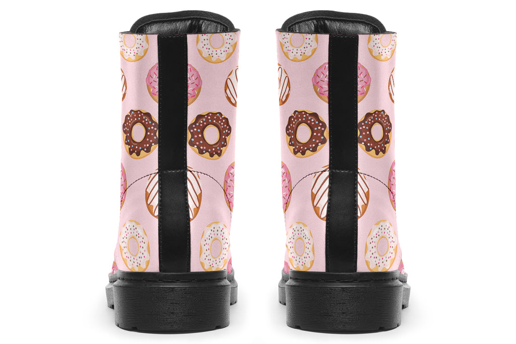Pink boots with a pattern of donuts all over them