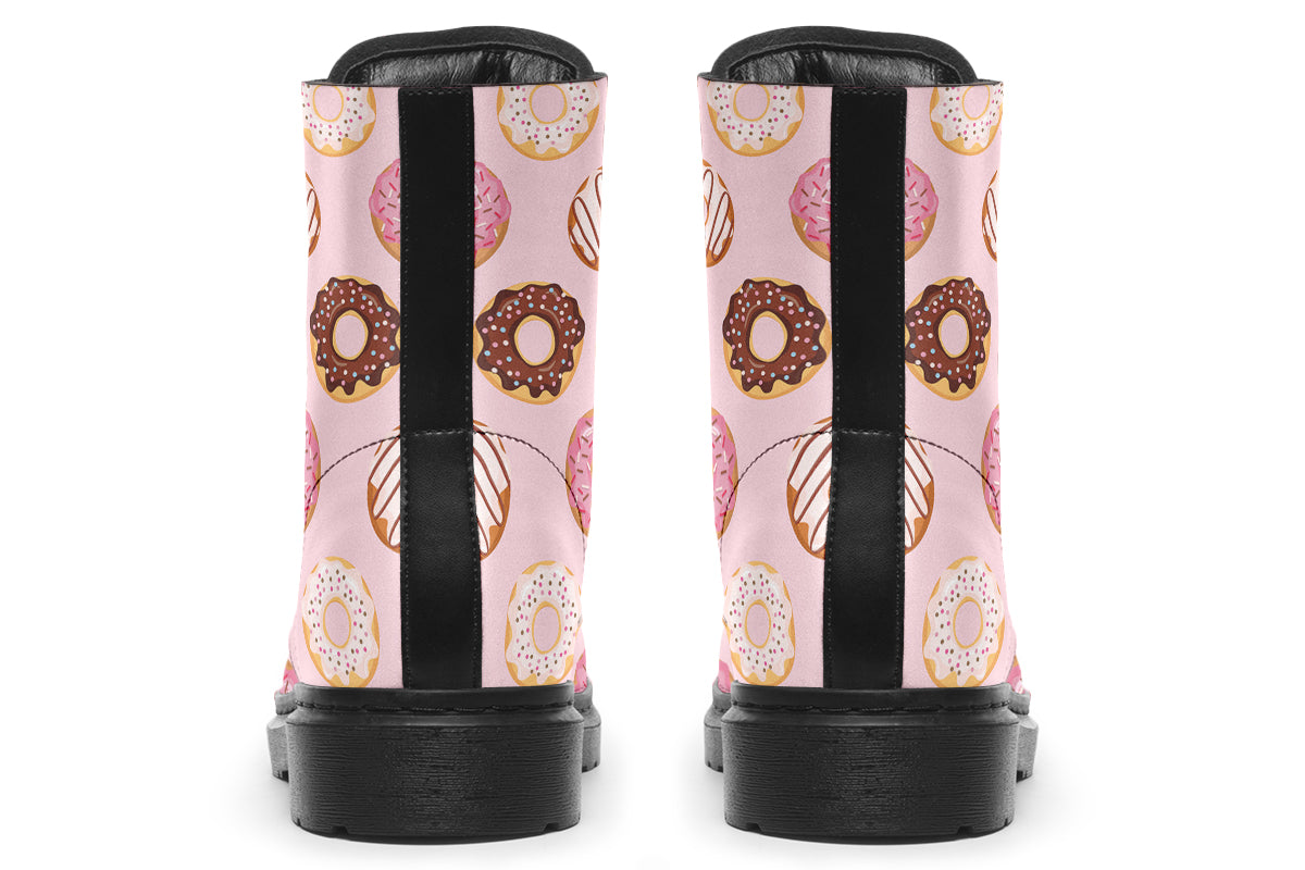 Pink boots with a pattern of donuts all over them