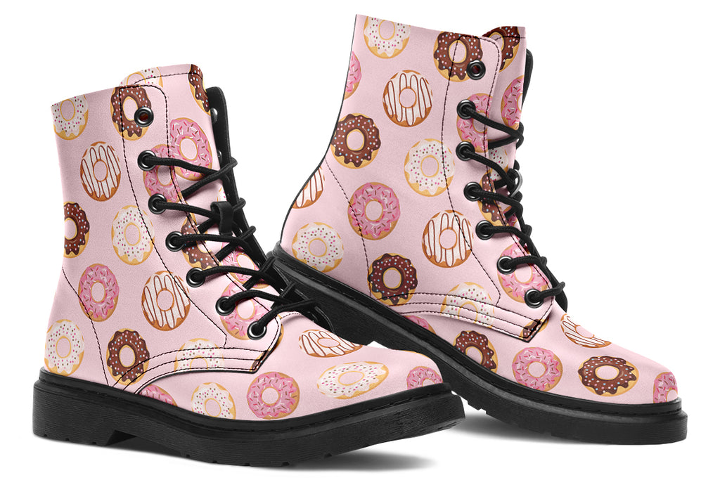 Pink boots with a pattern of donuts all over them