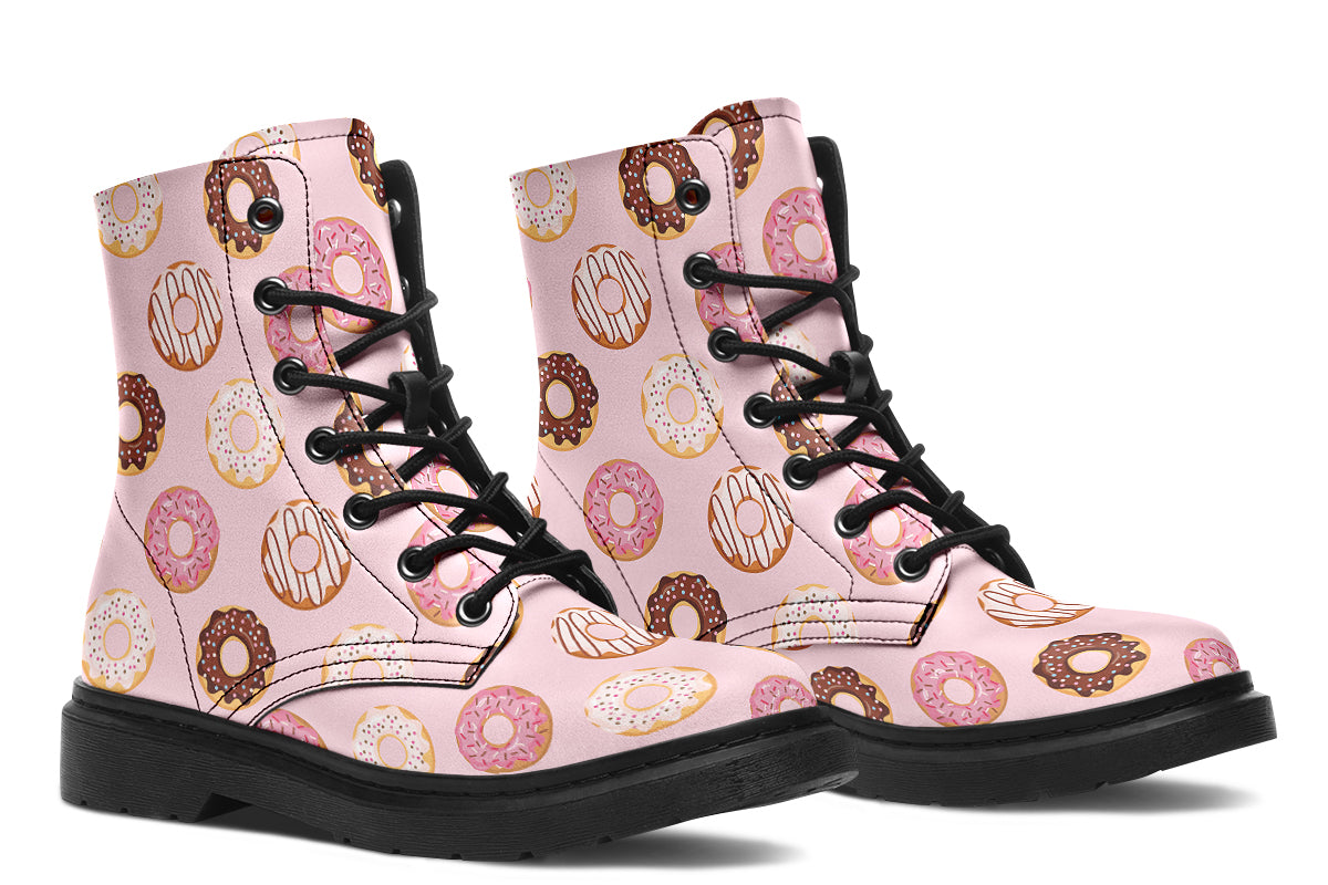 Pink boots with a pattern of donuts all over them