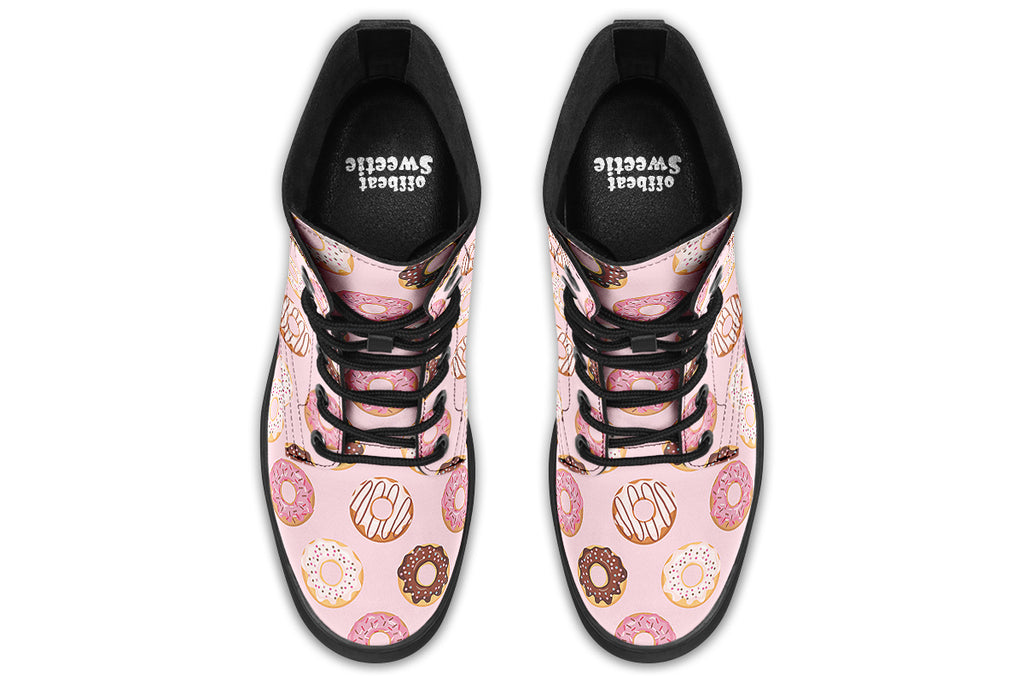 Pink boots with a pattern of donuts all over them