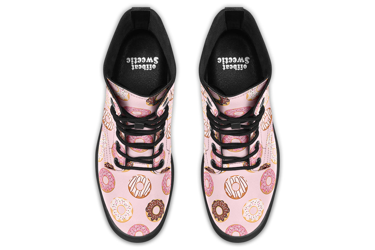 Pink boots with a pattern of donuts all over them