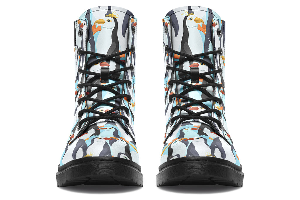 Light blue boots with a repetitive penguin pattern all over them.