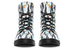 Light blue boots with a repetitive penguin pattern all over them.