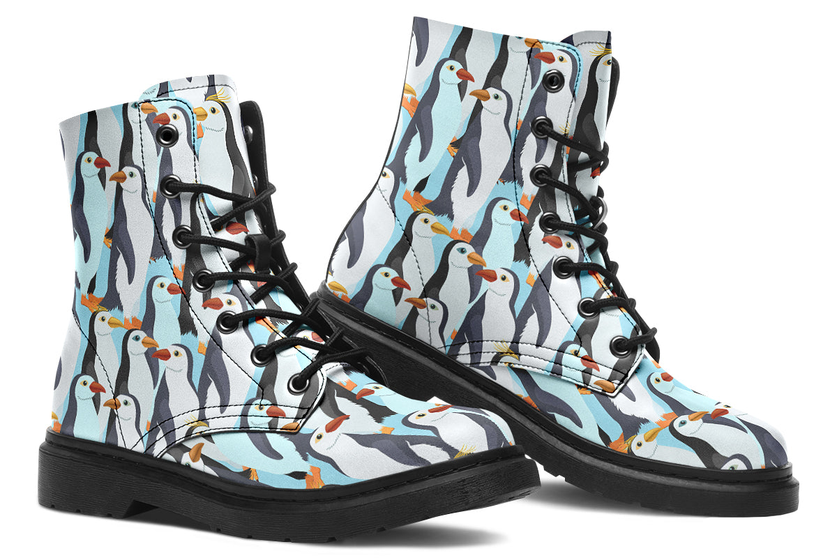 Light blue boots with a repetitive penguin pattern all over them.