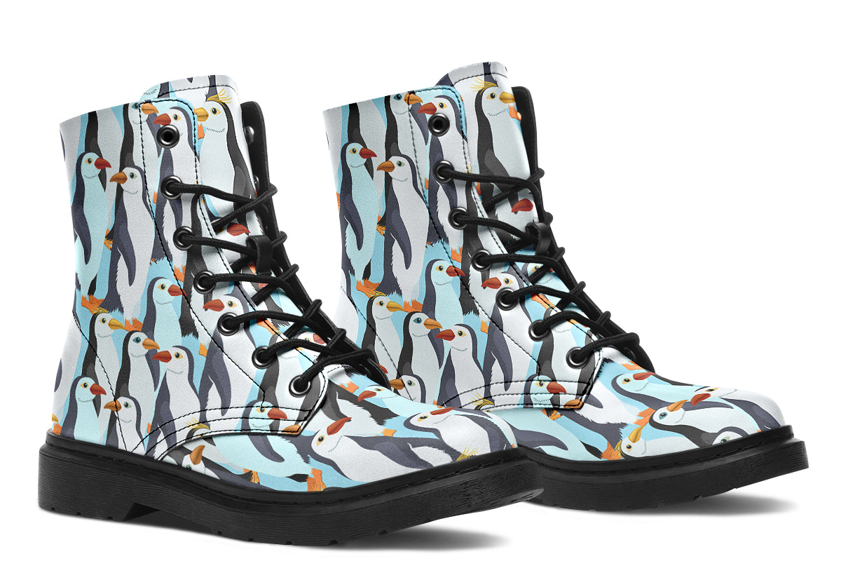 Light blue boots with a repetitive penguin pattern all over them.