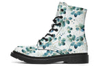 White boots featuring a green eucalyptus leaves pattern