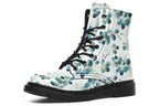 White boots featuring a green eucalyptus leaves pattern