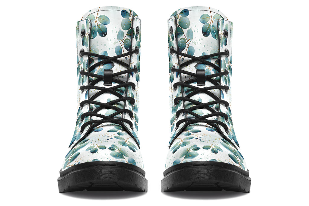 White boots featuring a green eucalyptus leaves pattern