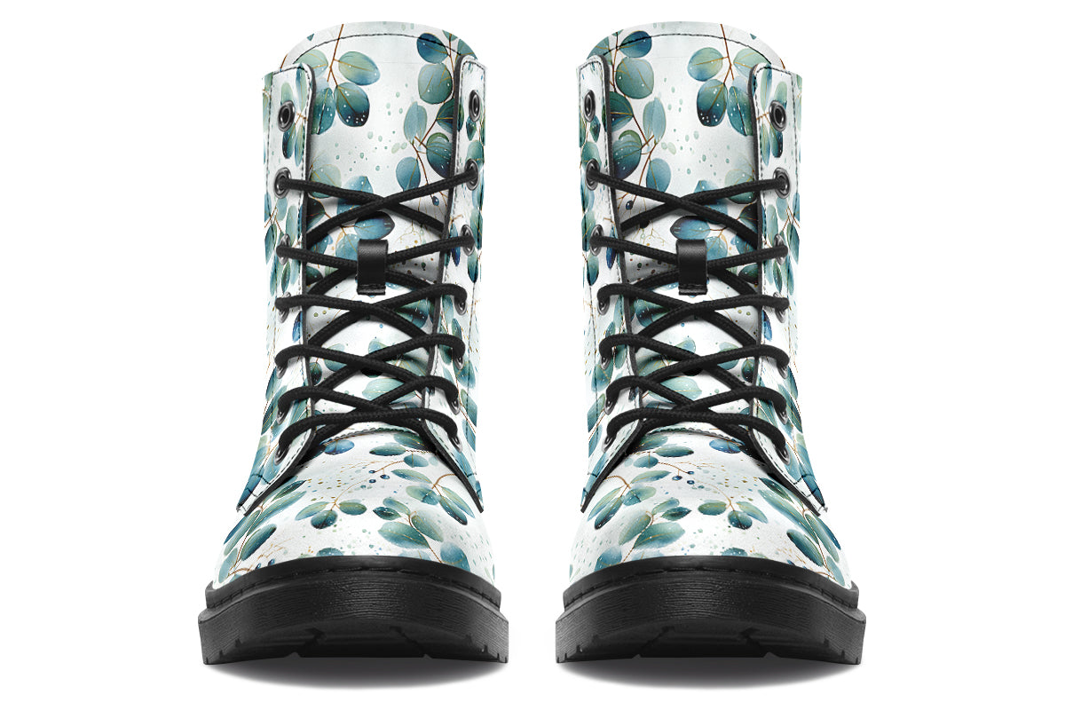White boots featuring a green eucalyptus leaves pattern