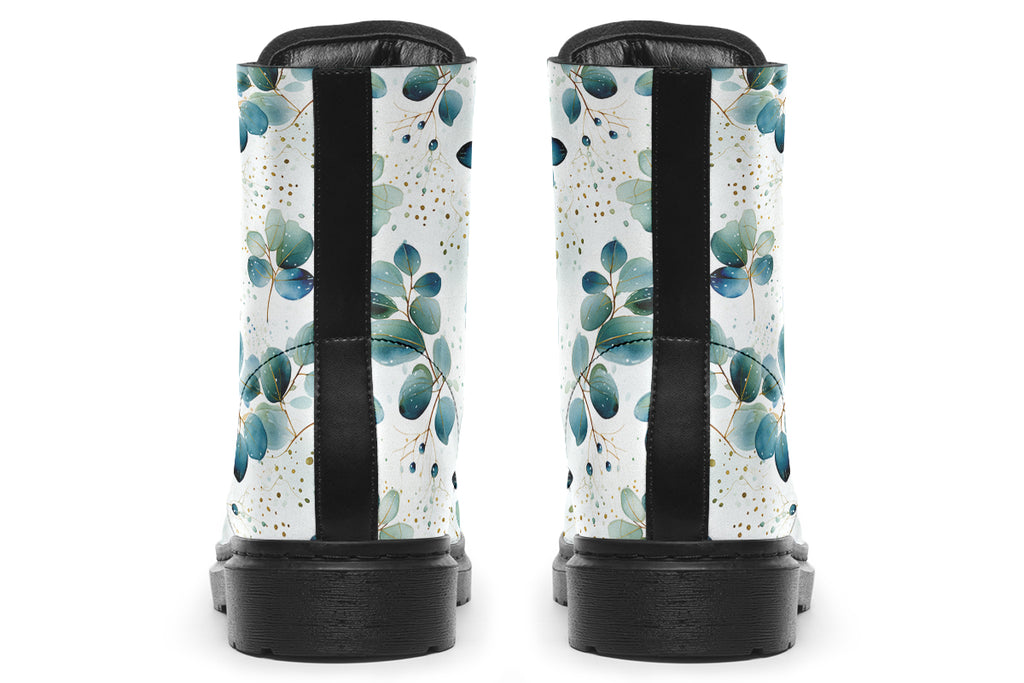 White boots featuring a green eucalyptus leaves pattern