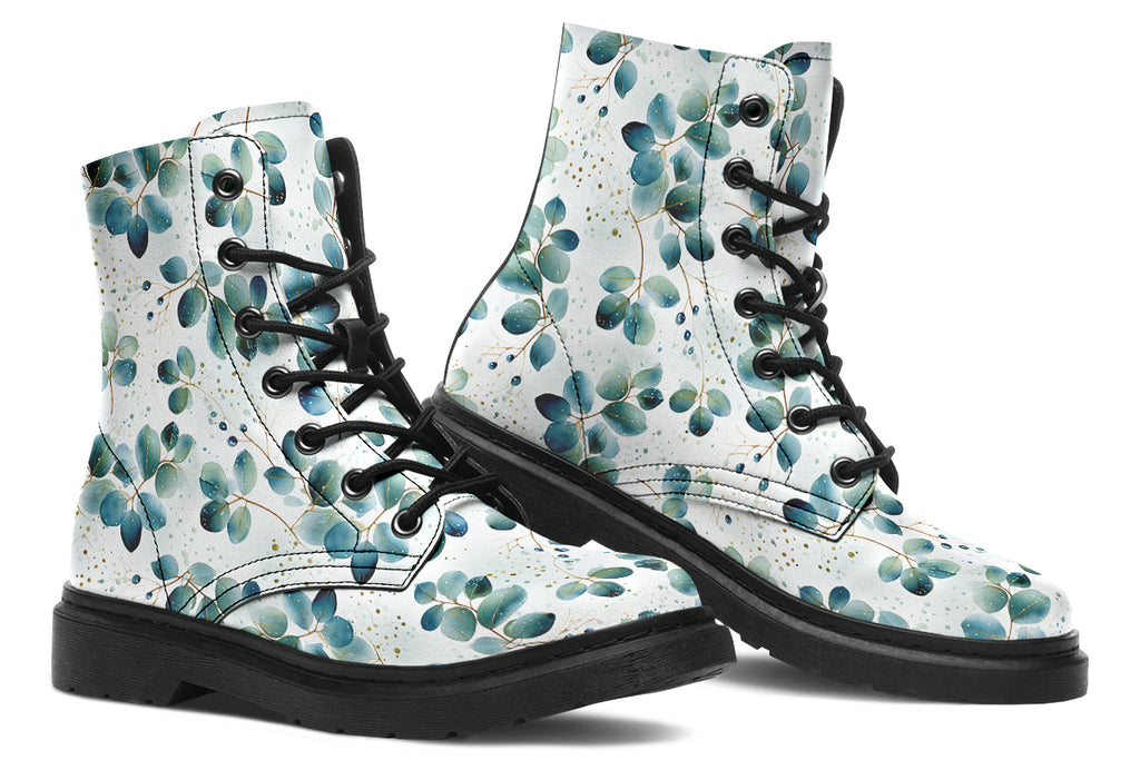 White boots featuring a green eucalyptus leaves pattern