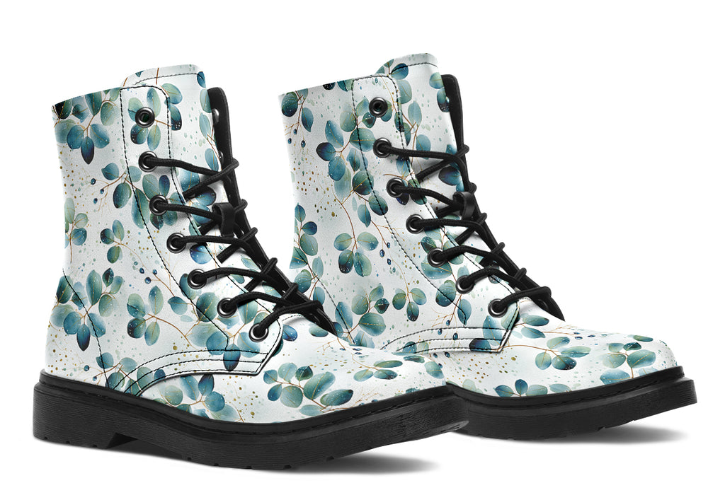 White boots featuring a green eucalyptus leaves pattern