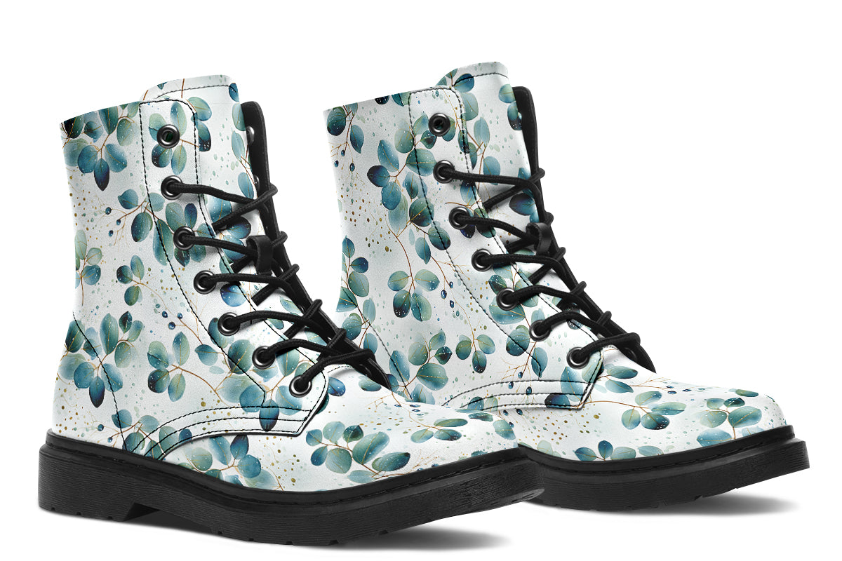 White boots featuring a green eucalyptus leaves pattern