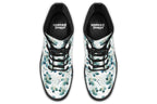 White boots featuring a green eucalyptus leaves pattern