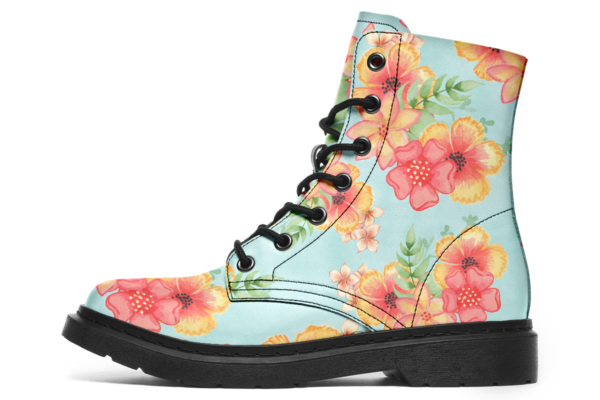Light blue boots with a pattern of florals in oranges and pinks.