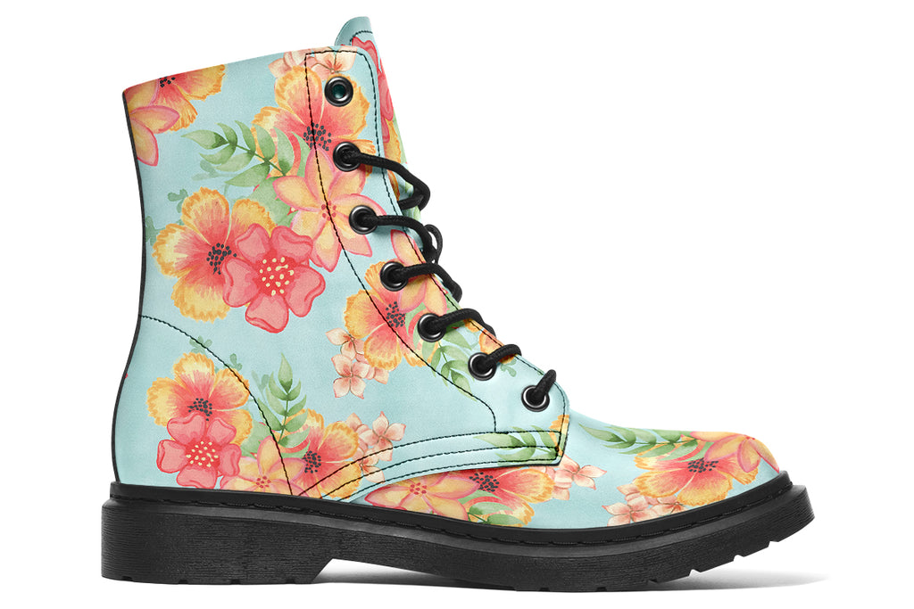 Light blue boots with a pattern of florals in oranges and pinks.