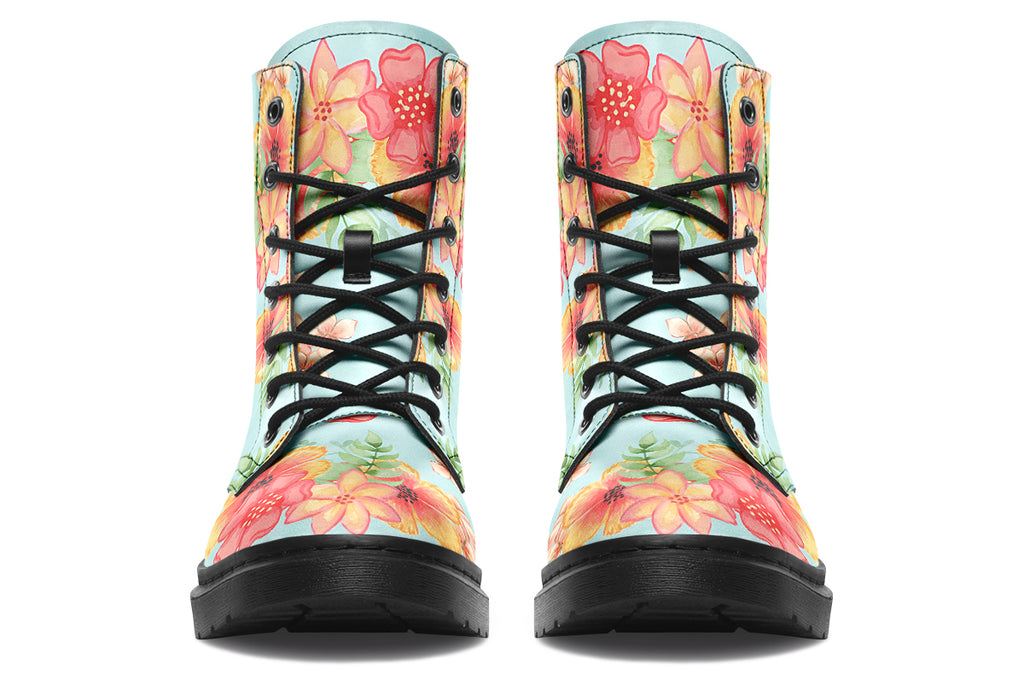 Light blue boots with a pattern of florals in oranges and pinks.