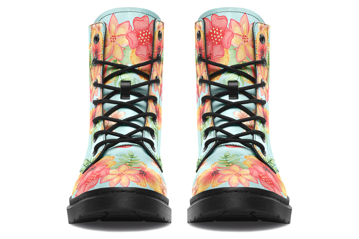Light blue boots with a pattern of florals in oranges and pinks.