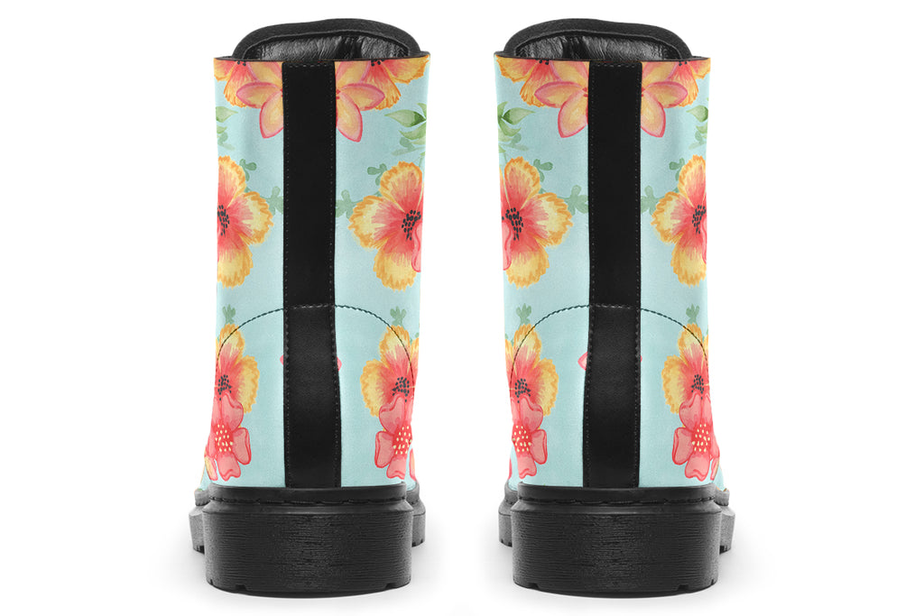 Light blue boots with a pattern of florals in oranges and pinks.