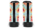 Light blue boots with a pattern of florals in oranges and pinks.