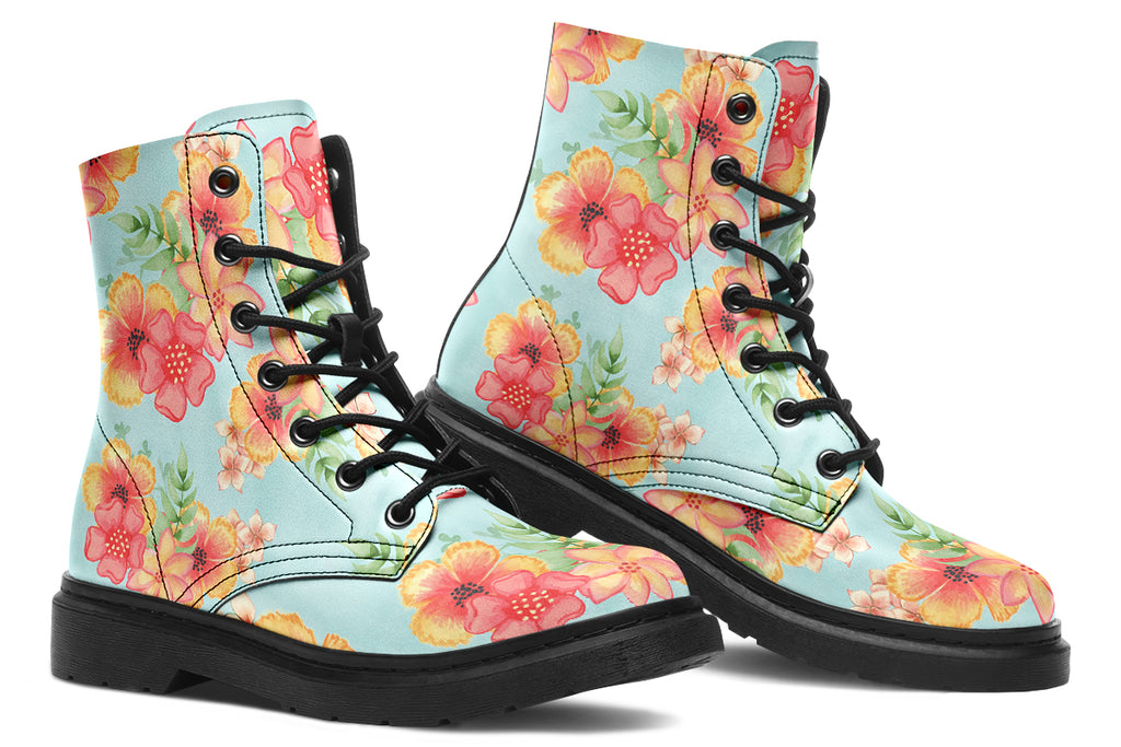 Light blue boots with a pattern of florals in oranges and pinks.