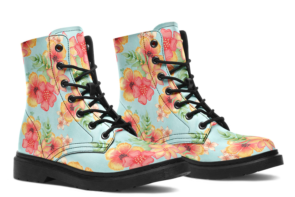 Light blue boots with a pattern of florals in oranges and pinks.