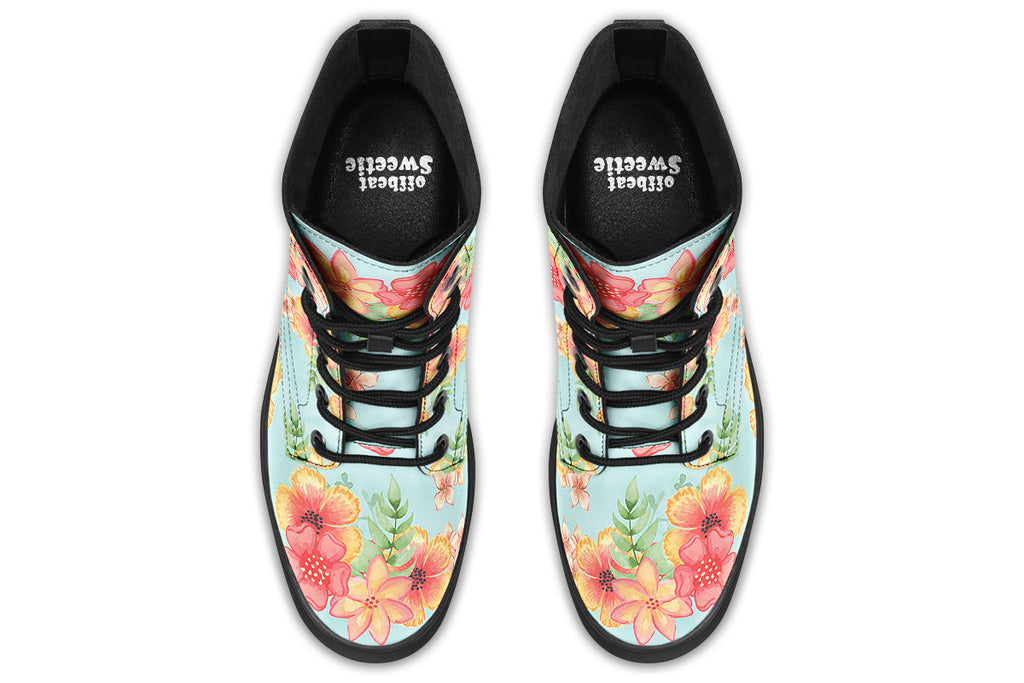 Light blue boots with a pattern of florals in oranges and pinks.