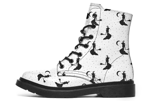 White boots with a repetitive black pattern of the silhouettes of witches on broomsticks