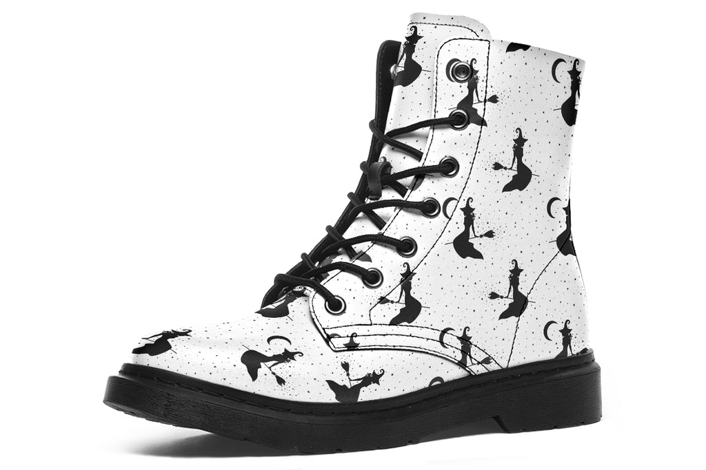 White boots with a repetitive black pattern of the silhouettes of witches on broomsticks